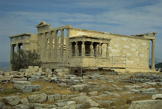 General view of the Erechtheion from the southwest, showing the North Porch (at left), the - The blue limestone foundations of the Old Athena Temple (built c. 510-500 BC and destroyed by the Persians in 480 BC) are visible in the foreground. Photo taken in 1998.