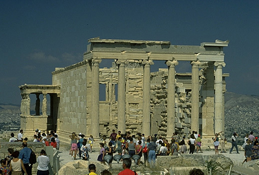 The east and south sides of the Erechtheion (with tourists for scale). - View from the east (and slightly to the south).