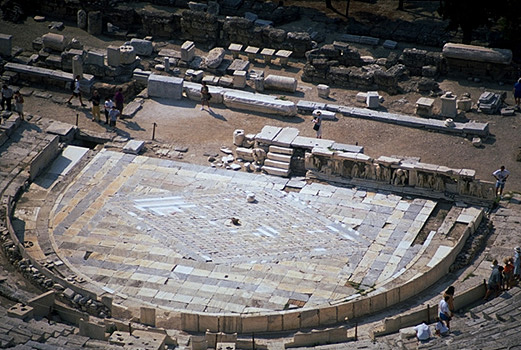 The Theater of Dionysos. - Detail of the orchestra and skene, incuding the Bema of Phaidros. View from the north (from the south wall of the Acropolis). Photo taken in 1998.