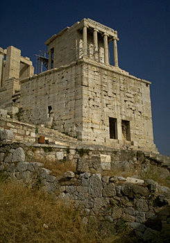 Nike Bastion and Temple of Athena Nike. - In the foreground is part a polygonal retaining wall for the early 6th century B.C. ramp leading to the Acropolis. View from the northwest.