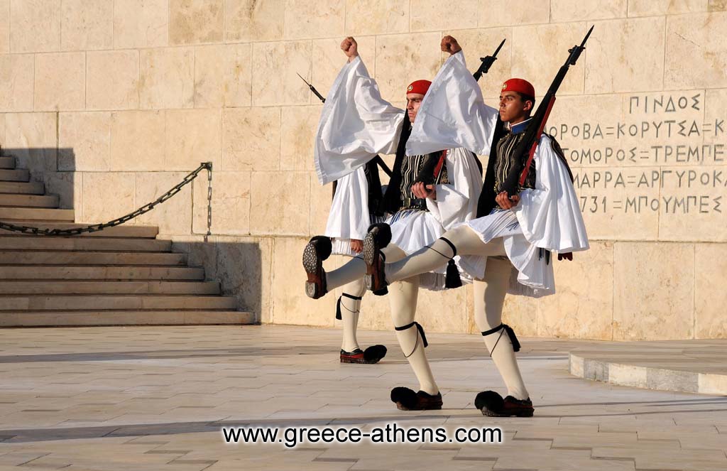 Evzones hange of guard - The Evzones, or Evzoni is the name of several historical elite light infantry and mountain units of the Greek Army. Today, it refers to the members of the Presidential Guard, an elite ceremonial unit that guards the Greek Tomb of the Unknown Soldier, the