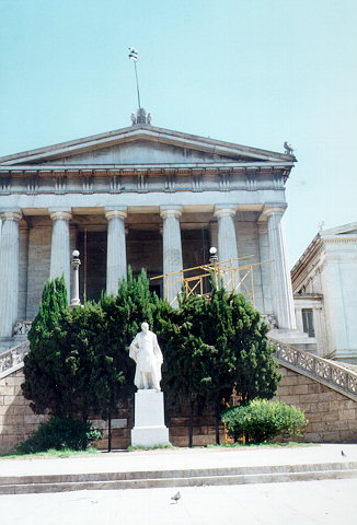 The Vallianios National Library entrance - The National Library forms part of the so-called Neoclassical Trilogy of the City of Athens: Academy - University - Library.
It consists of three solid parts, out of which the one in the middle -which is also the biggest- houses the Reading-Room.